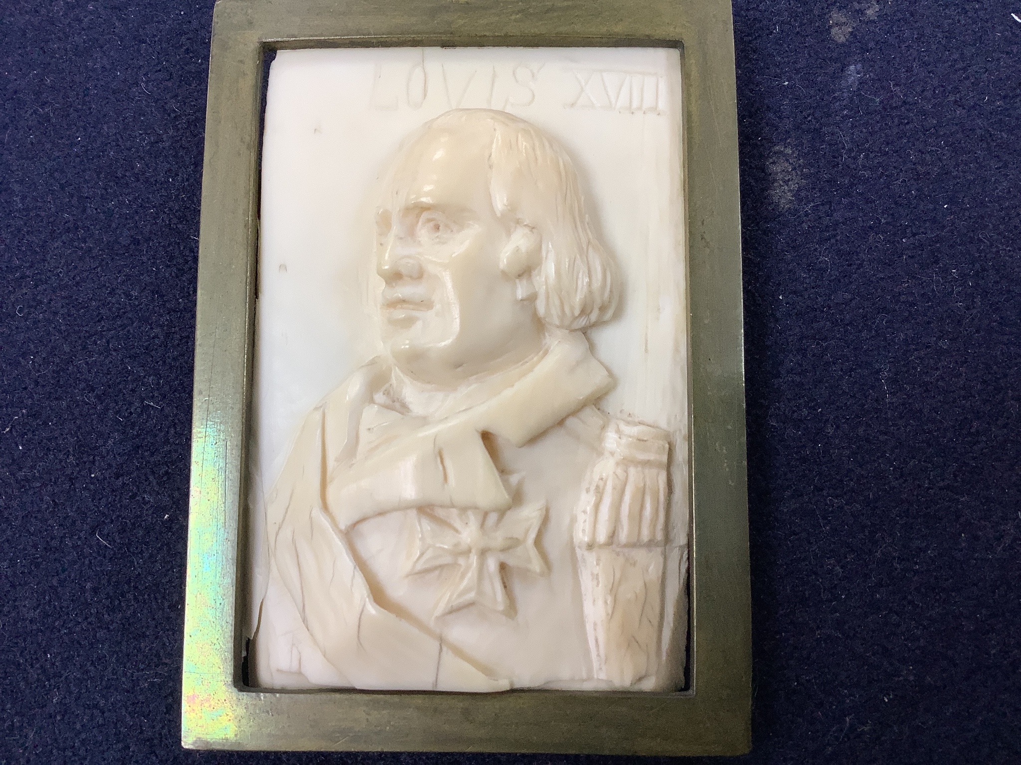 A pair of 19th century carved ivory portrait reliefs, Napoleon and Louis XVIII, 6 x 8.5cm